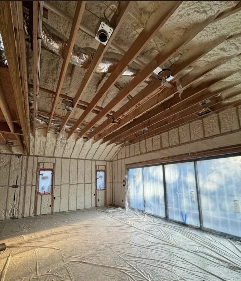 Interior walls and ceiling insulated with spray foam during new construction in Osage Beach